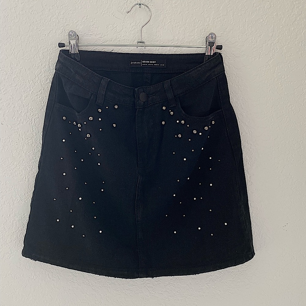 Denim black skirt with pearl details. Really good shape, like new!